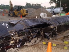 Who will cover the cleanup costs of an oil spill like this one by Enbridge into Michigan's Kalamazoo River?